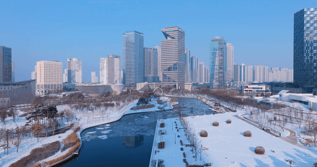 Snow-covered cityscape with modern buildings