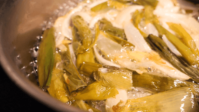 Green onion oil frying in pan