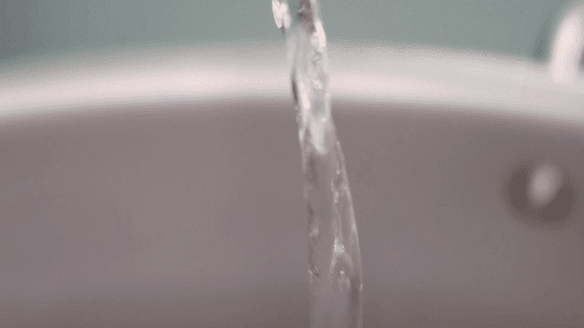 Water pouring into a pot