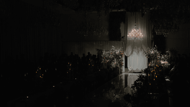 Gorgeous, dark wedding venue entrance and flower decorations