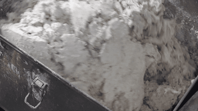Dough being mixed in a large industrial mixer