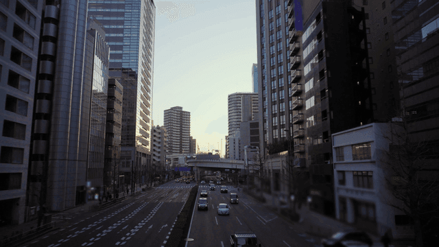 Bustling city street with tall buildings