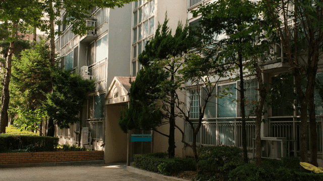 Apartment entrance surrounded by trees