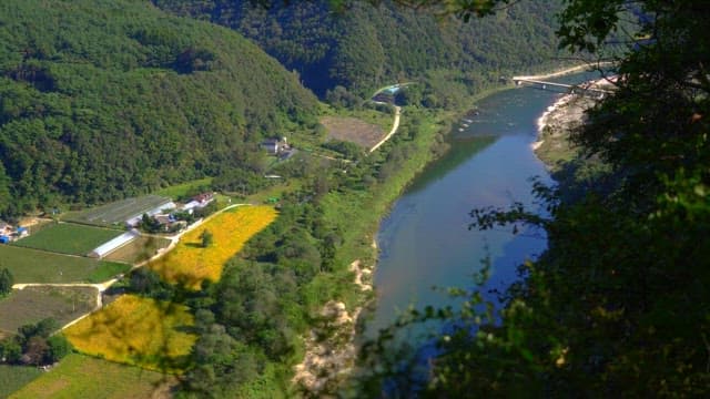 River flowing along the mountain that embraces the village