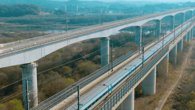 High-speed train crossing railway over bridge
