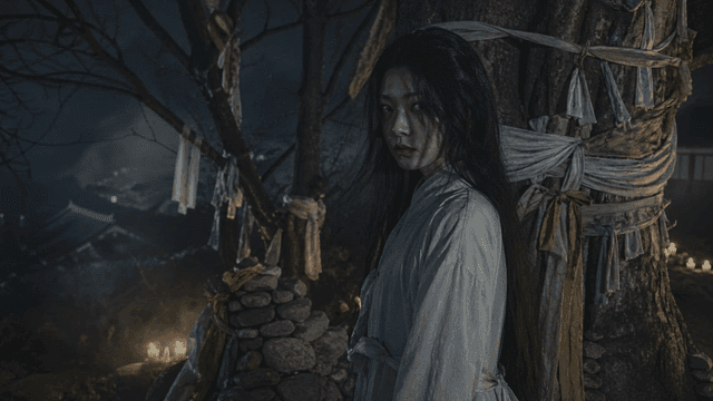 Maiden ghost in hanbok next to tree with tied cloths