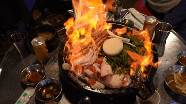 Grilled tripe with flames in restaurant