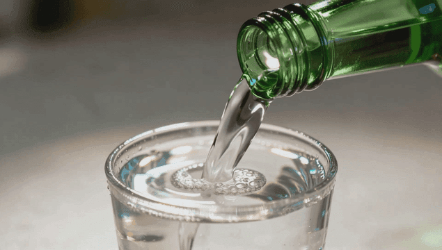 Pouring soju into a glass