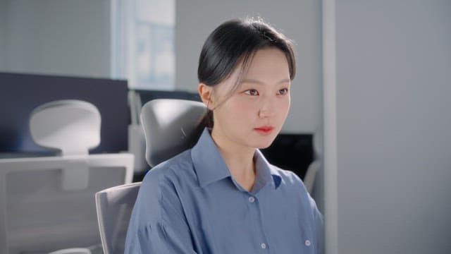 Woman working at a desk in an office