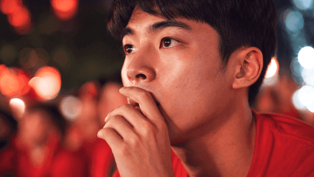 Young men watching sports game