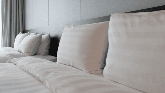 Neatly arranged pillows on a bed