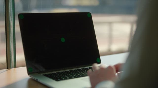 Person working on a laptop indoors