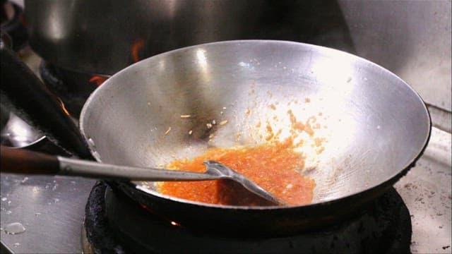 Stir-frying sauce in a hot wok