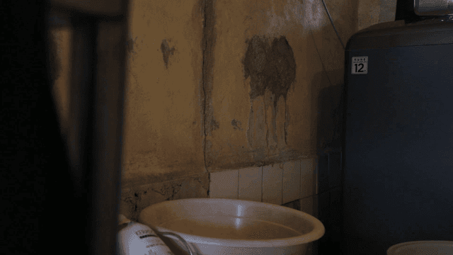 Washing machine and washbasin in bathroom