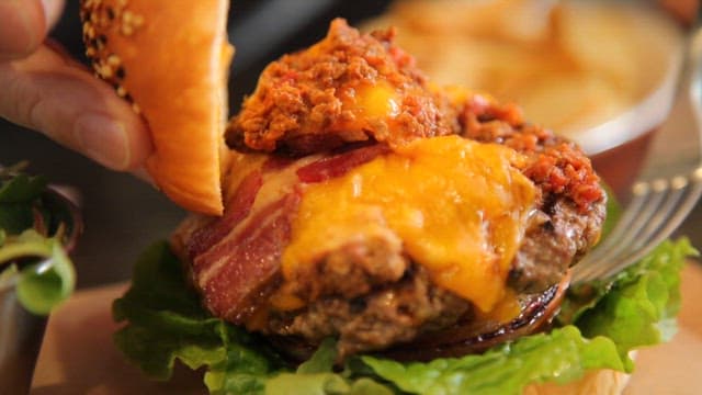 A juicy burger with cheese and bacon