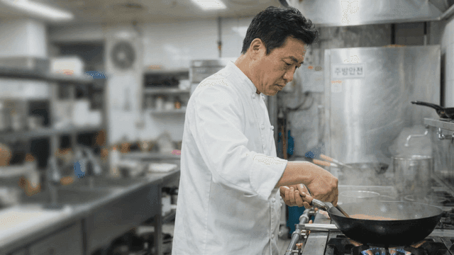 Chef cooking in a busy kitchen