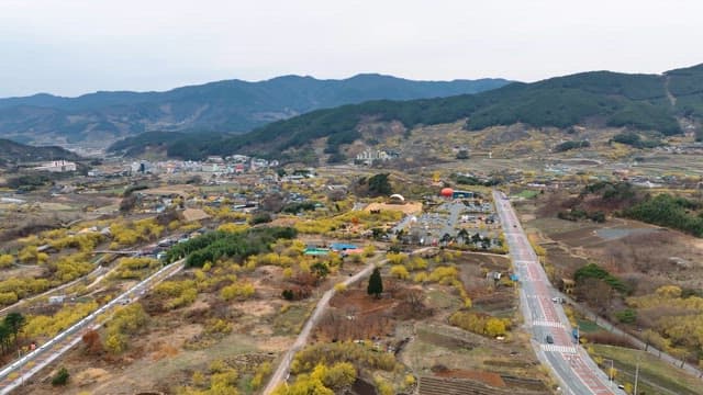 Scenic view of a rural village with mountains