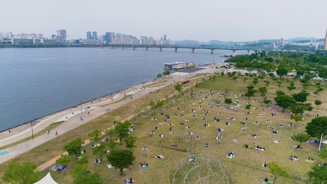 Riverside Park with Relaxing People