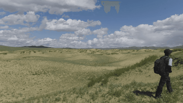 Person exploring vast grassland landscape