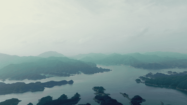 Tranquil lake surrounded by mountains
