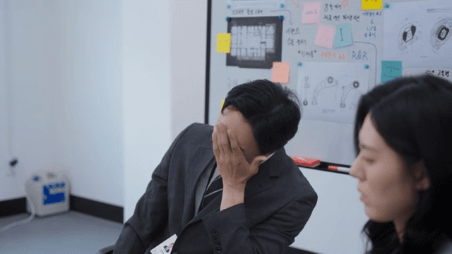 A team in despair after hearing about a lost deal over the phone