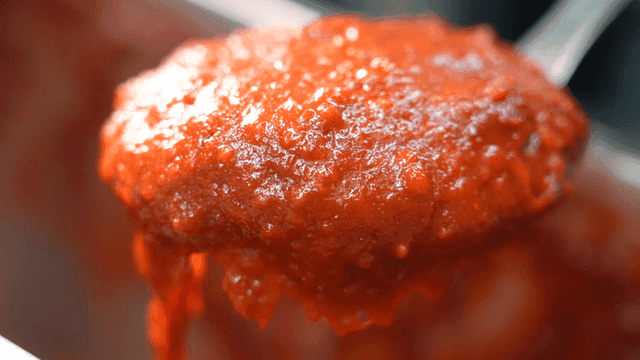 Ladleful of seasoning sauce