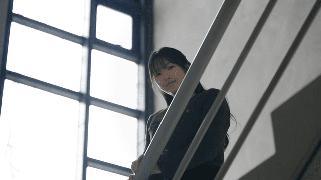 Young woman smiling on stairs