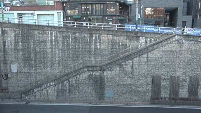 Quiet street staircase running along the wall