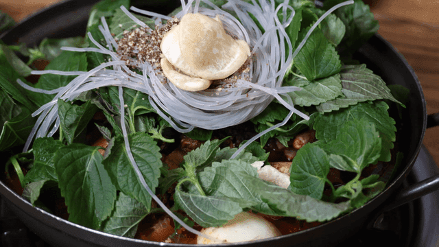 Gamjatang topped with fresh perilla leaves