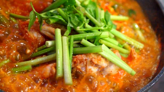 Spicy shaggy sea raven stew boiling in a pot