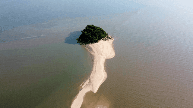 Small island surrounded by calm sea