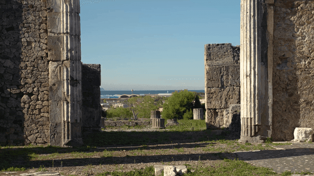 Ancient ruins and sea in distance