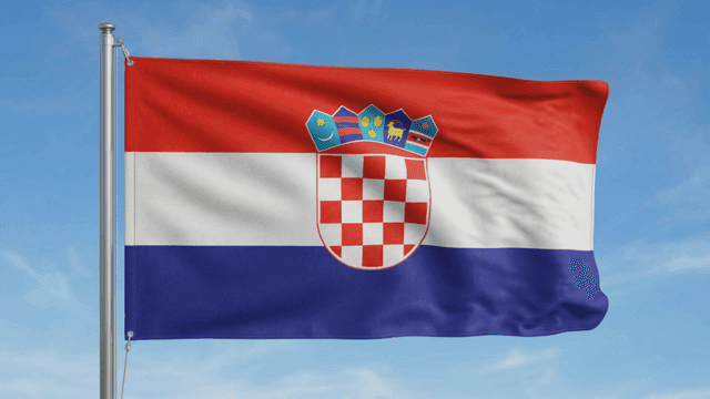 Croatian flag waving against a clear sky
