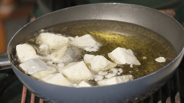 Eggplant pieces frying in hot oil