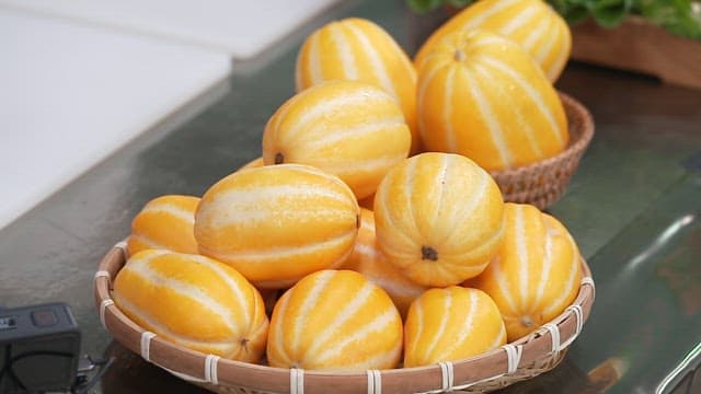 Freshly Harvested Korean Melons in a Wooden Basket