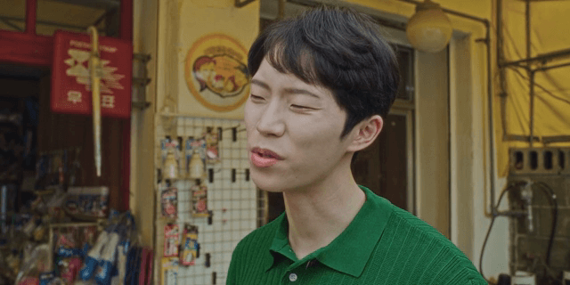 A man speaking with a displeased expression