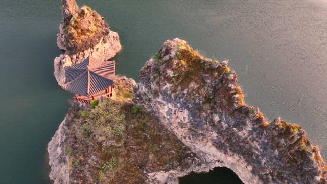 Traditional pavilion on rocky cliffs