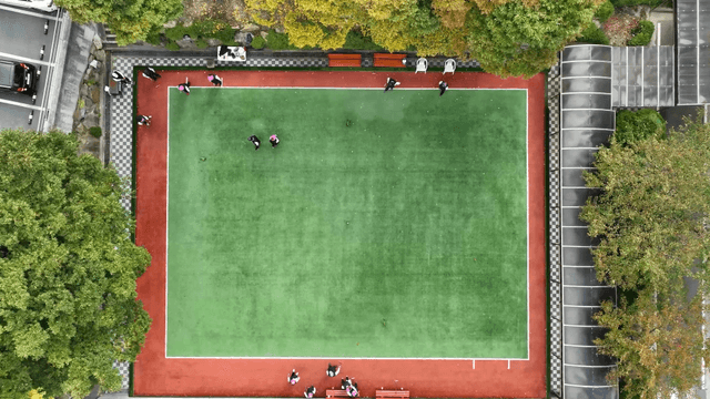People playing on green gateball field