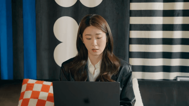 Woman working on a laptop indoors