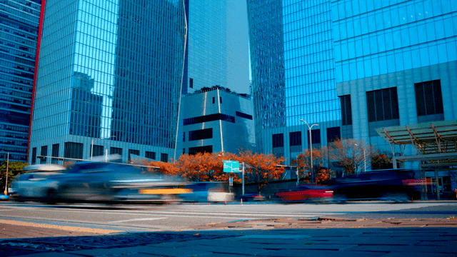 Bustling city street with tall buildings
