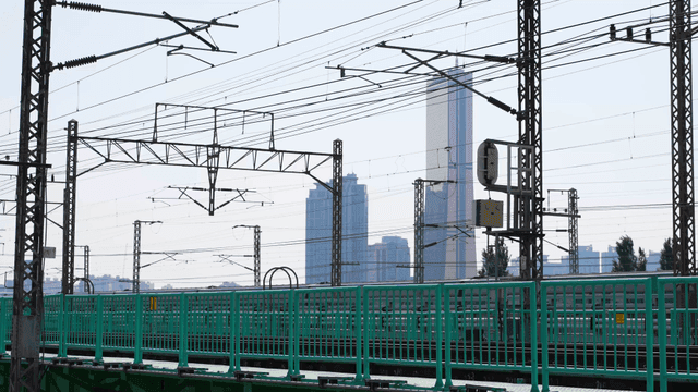 Train passing through a cityscape