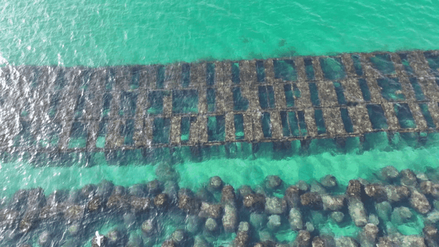 Clear turquoise sea with underwater structures