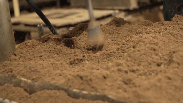 Scene of soil being compacted with a machine