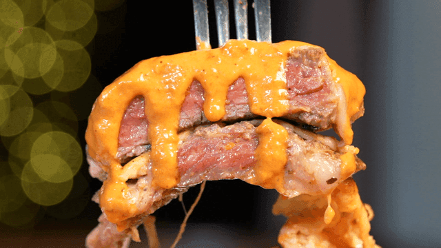 Juicy steak with melted cheese sauce