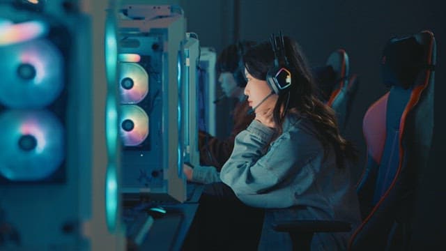 Gamers Focused on Intense Gameplay Indoors