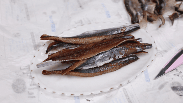 Dried fish on a white plate