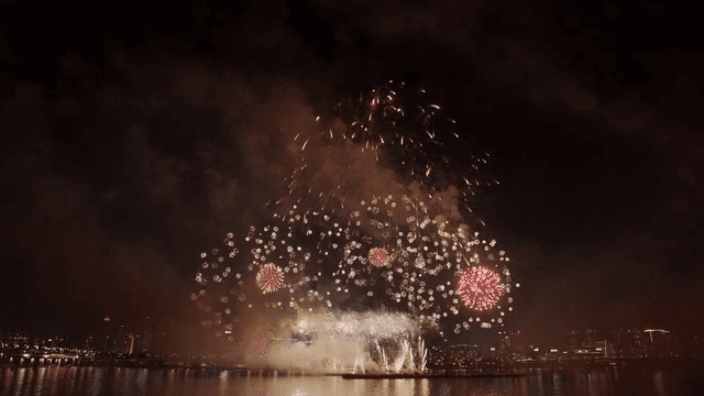 Fireworks display over a city skyline