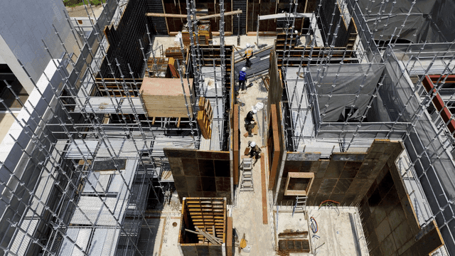 Construction site with scaffolding and workers