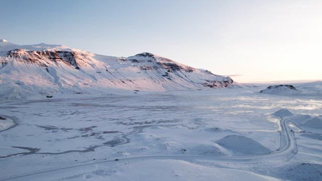 Snow-covered mountains and frozen landscape