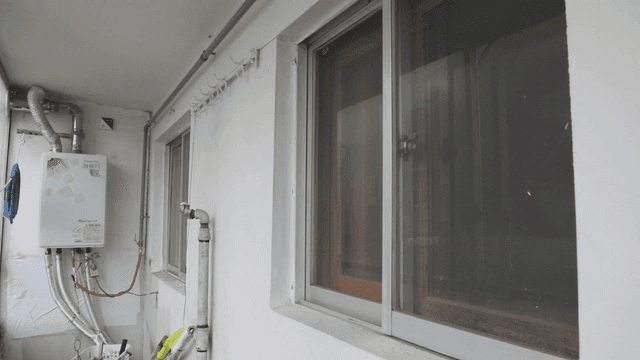 Apartment balcony with utility pipes